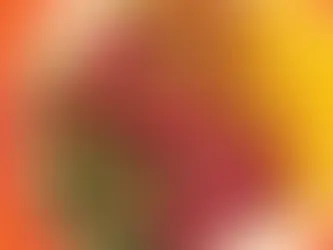 Overhead view of sliced grass-fed ribeye steak cooked medium-rare, served with roasted cauliflower, spiced eggplant puree, and a fresh herb salad with pomegranate seeds on a white plate.