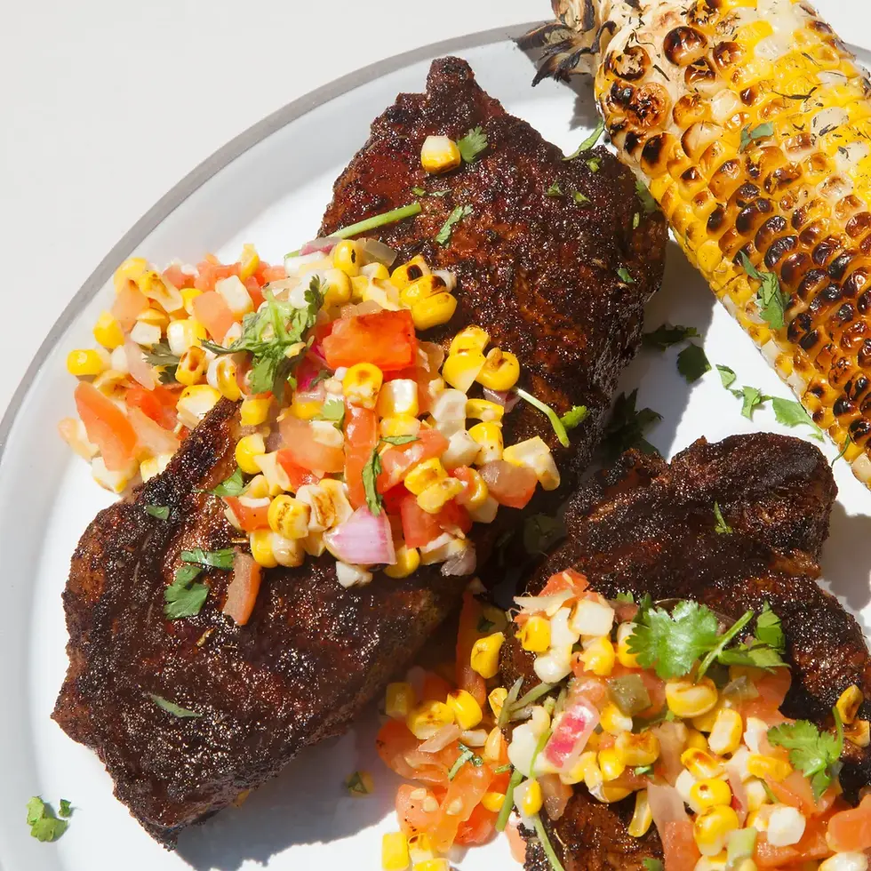 Chili rubbed New York strip steak with corn salsa.