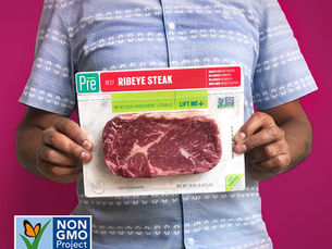 A person holding a package of Pre beef
