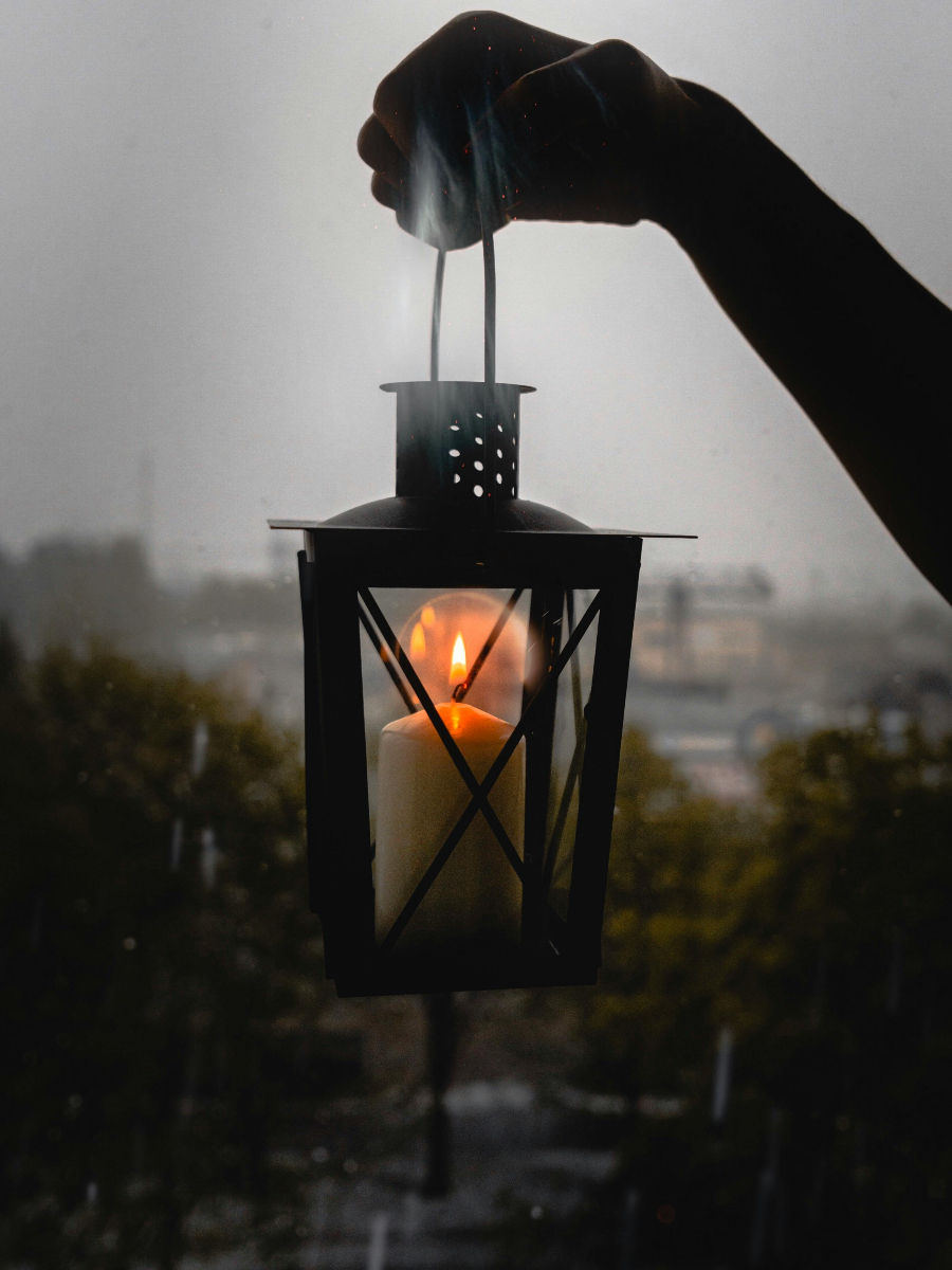 Candle lantern providing light at dusk