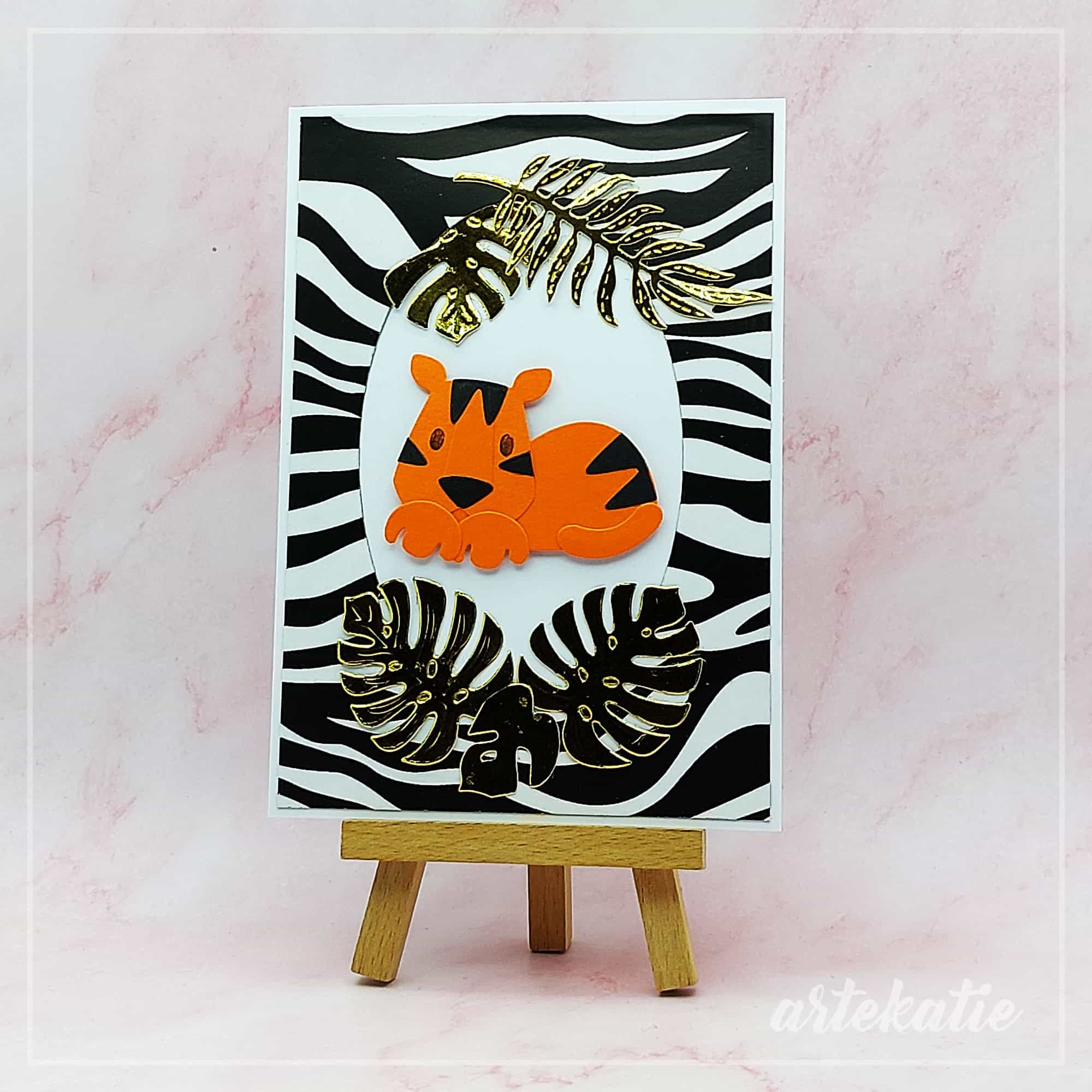 Tiger handmade card on zebra background. 