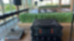 Wireless microphone rack and compact mixer set up for a daytime event