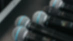 Collection of Shure wireless microphones placed in a hard case, ready for deployment during a live show