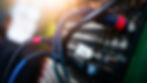 Close-up of audio cables connected to a mixer, useful for identifying signal flow issues during live events