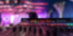 Live sound board with illuminated controls during corporate event audio recording and mixing workflow