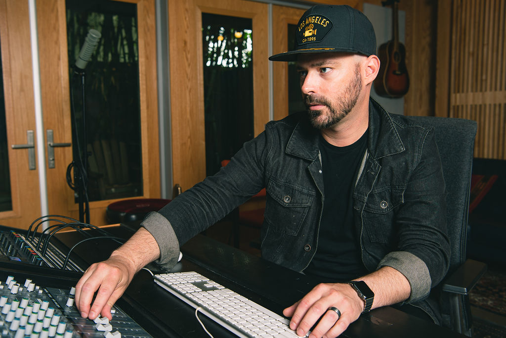 Aaron McLendon in studio – music producer and curator creating original sound for fitness brands