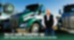 David Nickum standing by a green Valley Farm Transport truck.