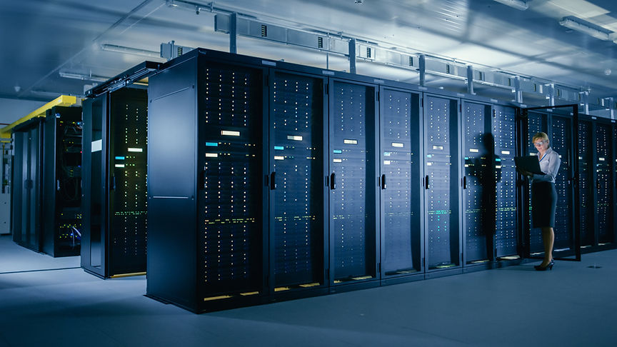 In Data Center_ Female IT Technician Stands before Open Server Rack Cabinet, Uses Laptop C
