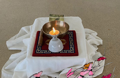 A candle centers our experience