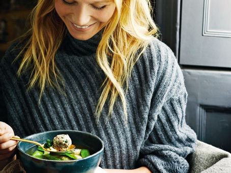 Gwyneth Paltrow enjoying a meal from a bowl