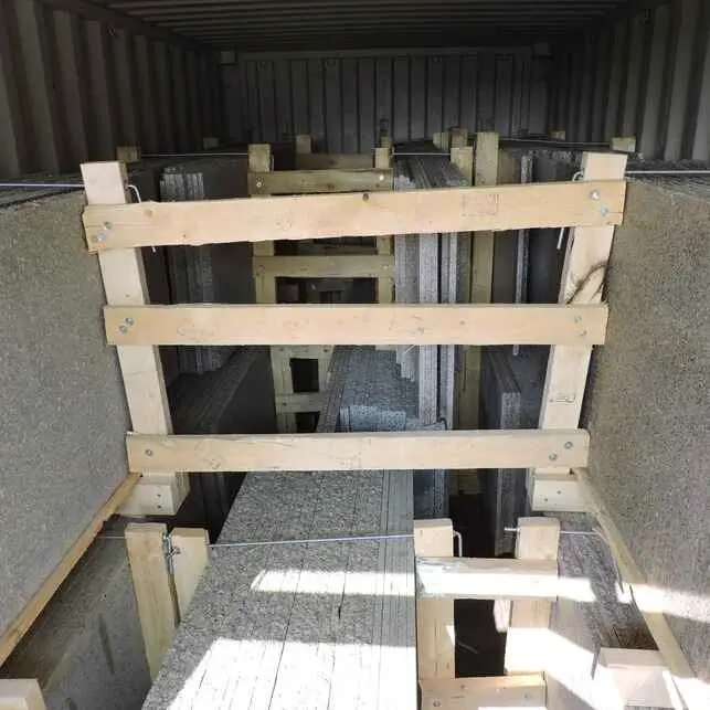 "Granite slabs stacked in wooden crates with dimensions and material labels clearly marked."
