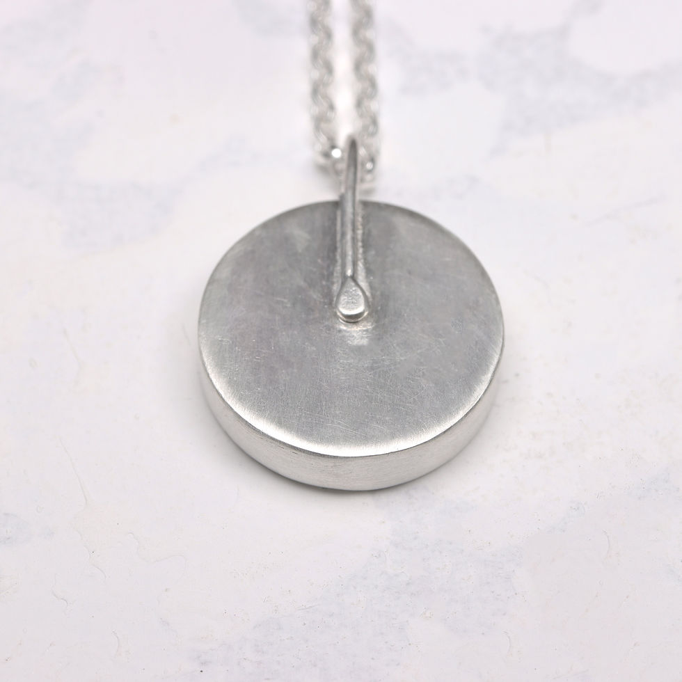 Thumbnail: Back view of green leaf patterned aluminium and silver pendant necklace on a white background