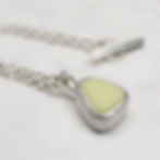 Thumbnail: Pastel lemon yellow milk sea glass silver pendant necklace on a white background