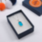 Thumbnail: Aqua blue sea glass and silver pendant necklace in a jewellery box on a white background