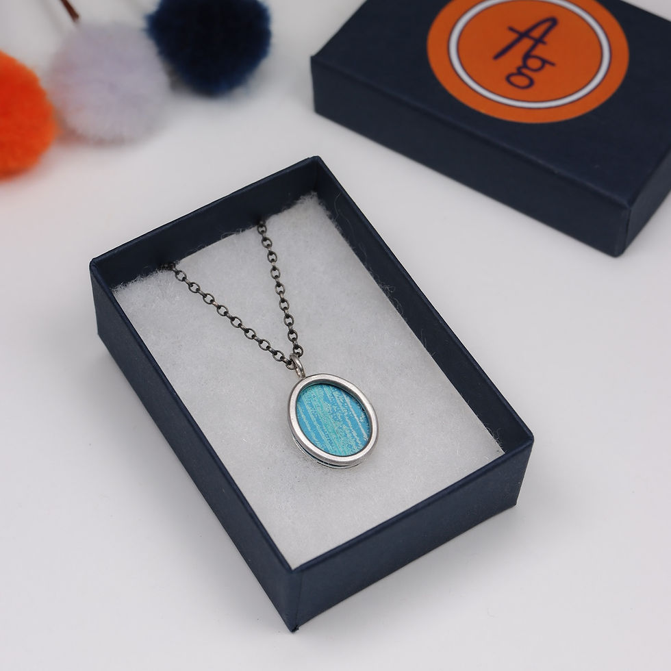 Thumbnail: Turquoise teal and duck egg blue anodised aluminium silver necklace in a jewellery box on a white background