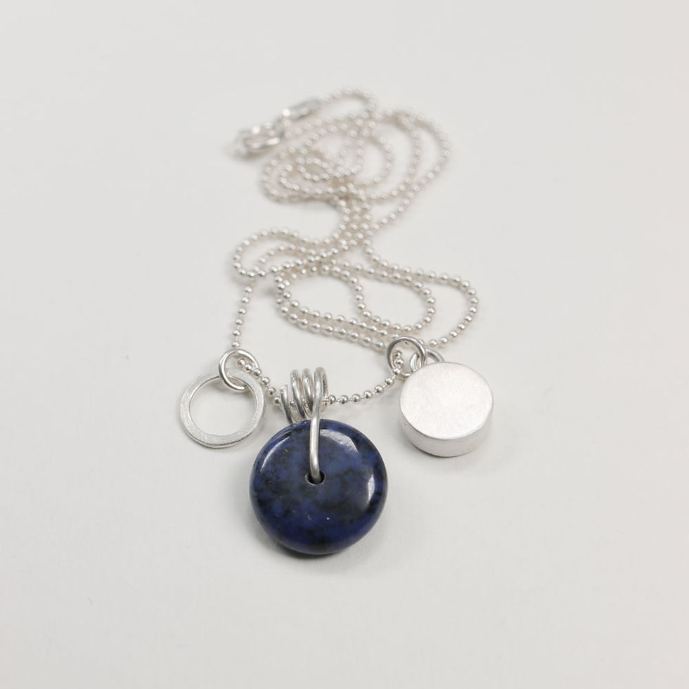 Thumbnail: Back view of sloe sodalite, aluminium and silver cluster necklace on a white background