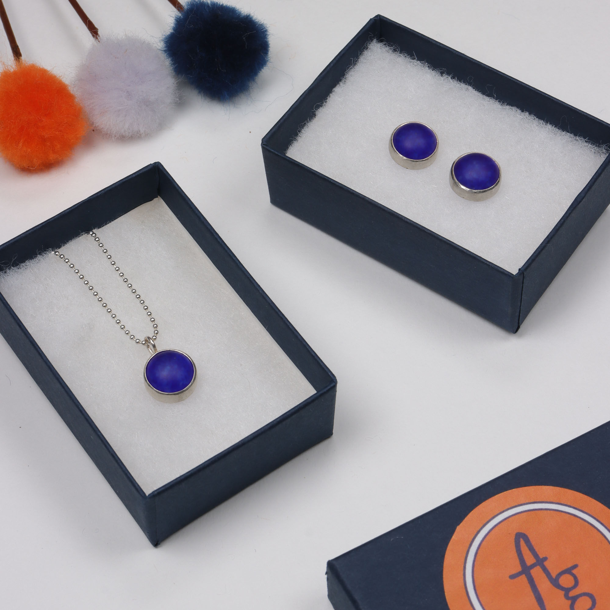 Royal blue sea glass cabochon silver cute necklace and earrings on a white background