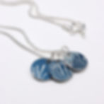 Midnight blue and silver mini trio disc necklace on a white background