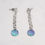 Thumbnail: Teal green and purple silver chain dangly earrings on a white background