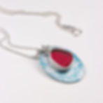 Blue and red sea glass and silver 3 in 1 cluster necklace on a white background