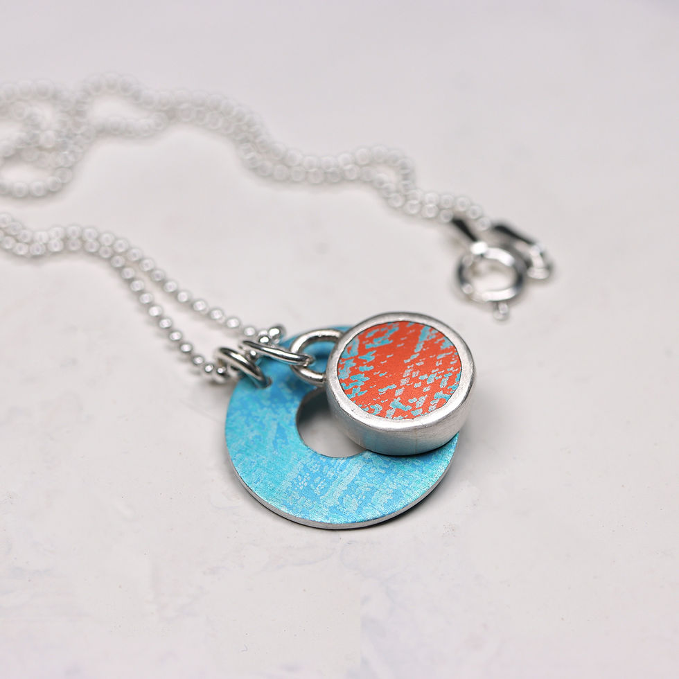 Thumbnail: Turquoise and orange silver necklace on white background