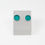 Thumbnail: Aqua green sea glass cabochon silver stud earrings on an earring stand on a white background