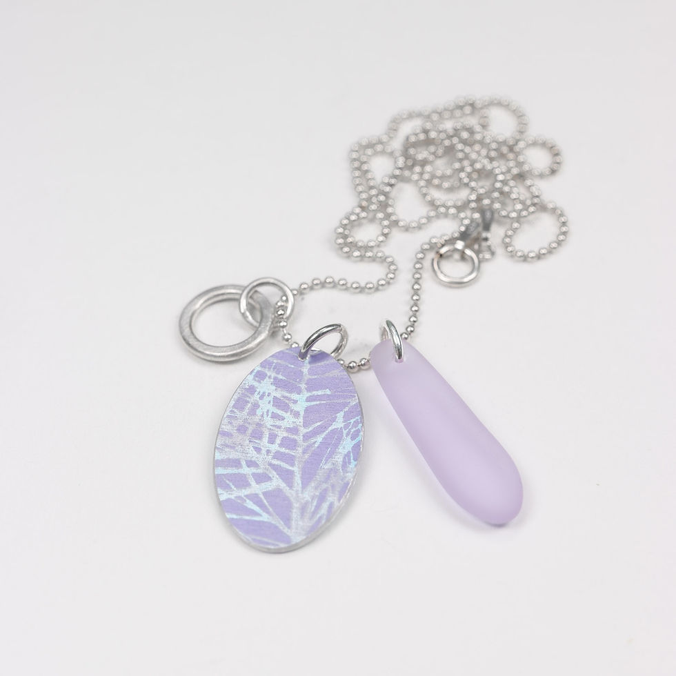 Thumbnail: Lilac purple aluminium and cultured sea glass silver cluster necklace on a white background