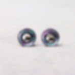 Magenta pink and blue aluminium and silver interchangeable stud earrings on a white background