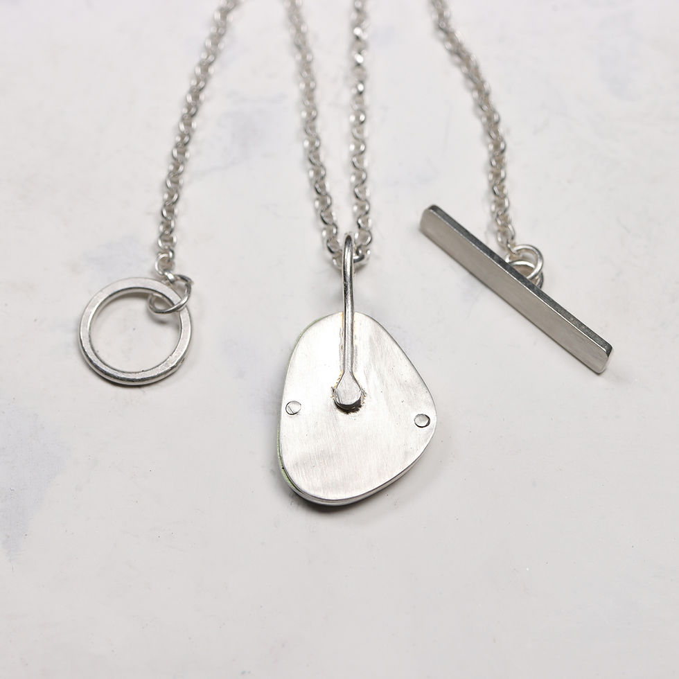 Thumbnail: Back view of lime green and denim blue vertical triangular silver and aluminium pendant necklace