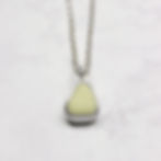 Thumbnail: Pastel lemon yellow milk sea glass silver pendant necklace on a white background