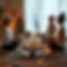 6 women meditating and sitting in a circle with herbs, candles and crystals .jpg