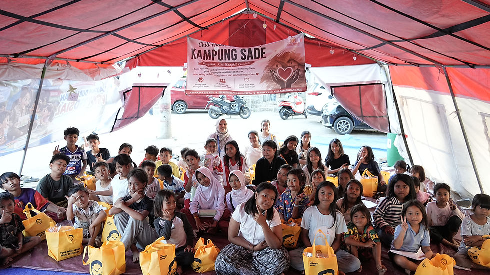 Group photo of the SUMMIT team with children in Sade village.