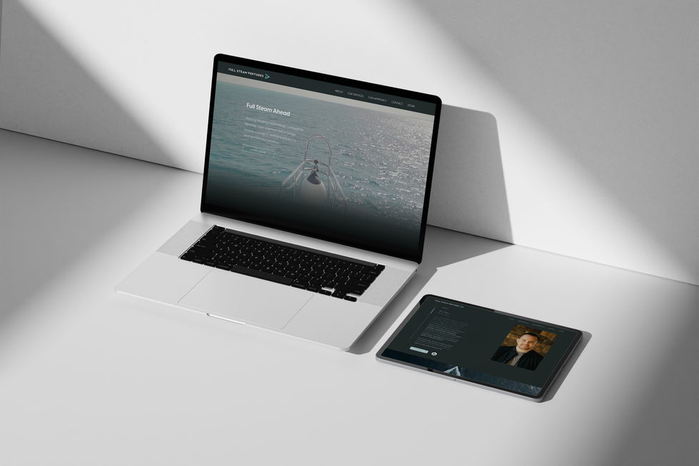 Laptop and tablet displaying a website design.