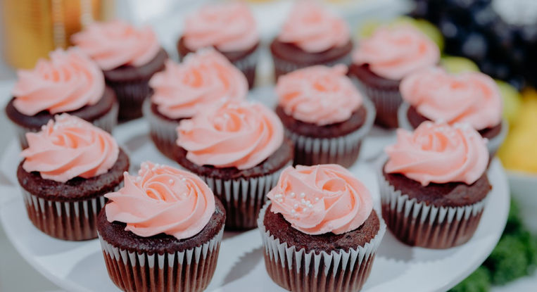 Elegant dessert buffet catering display with floral decor at Styld Spaces Toronto