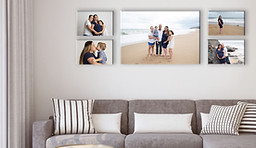 5 canvas prints hanging in a lounge room