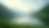 Wide angle view of a serene landscape with a calm lake and lush greenery