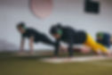 Yoga Class performing table top position.