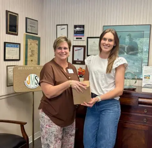 Fifth Street Ministries Executive Director, Tamara Roach receives a generous gift from JMS Southeast and Statesville Process Instruments.