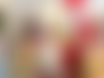 Santa in red robe with kids opening gifts on a couch. Christmas tree with ornaments in the background. Joyful holiday mood.