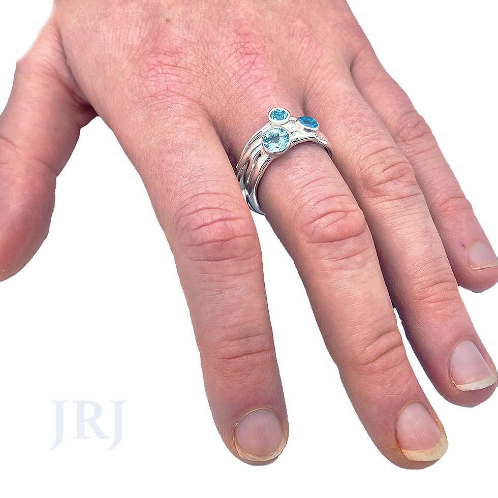 Thumbnail: Sculptural sterling silver gemstone ring worn on hand