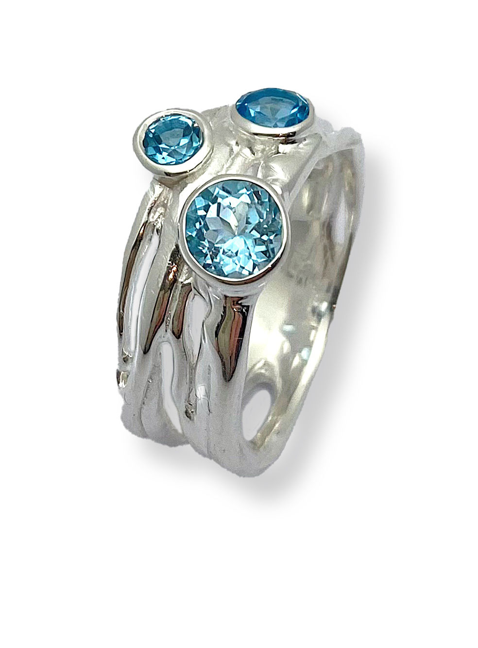 Sterling silver organic trio gemstone ring with blue topaz on white background