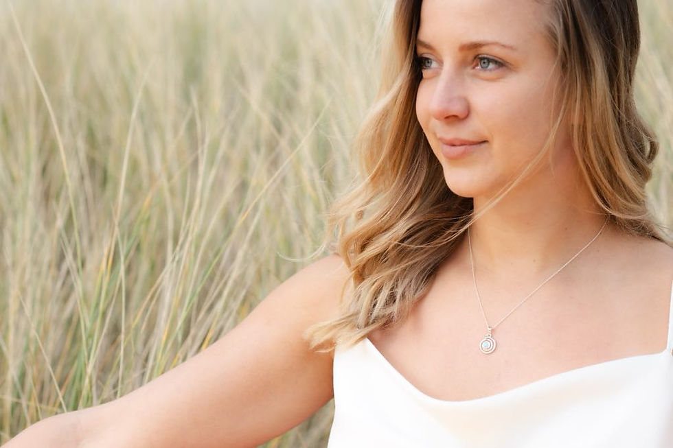 Thumbnail: Sterling silver swirl pendant with gemstone set in polished circular frame