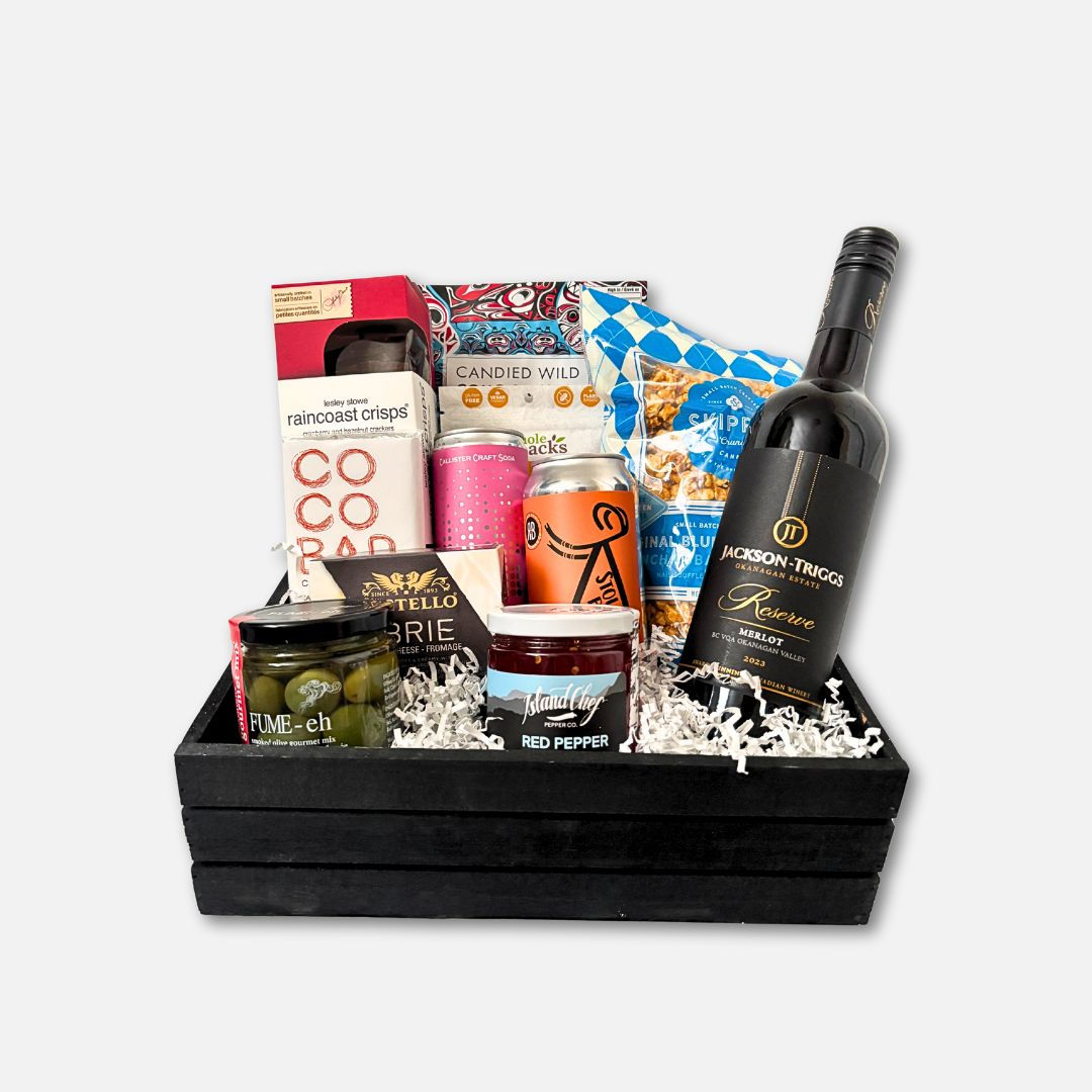 Gift Basket that includes BC products; cheese, jelly, olives, crisps, smoked salmon, popcorn, wine, soda and chocolate.