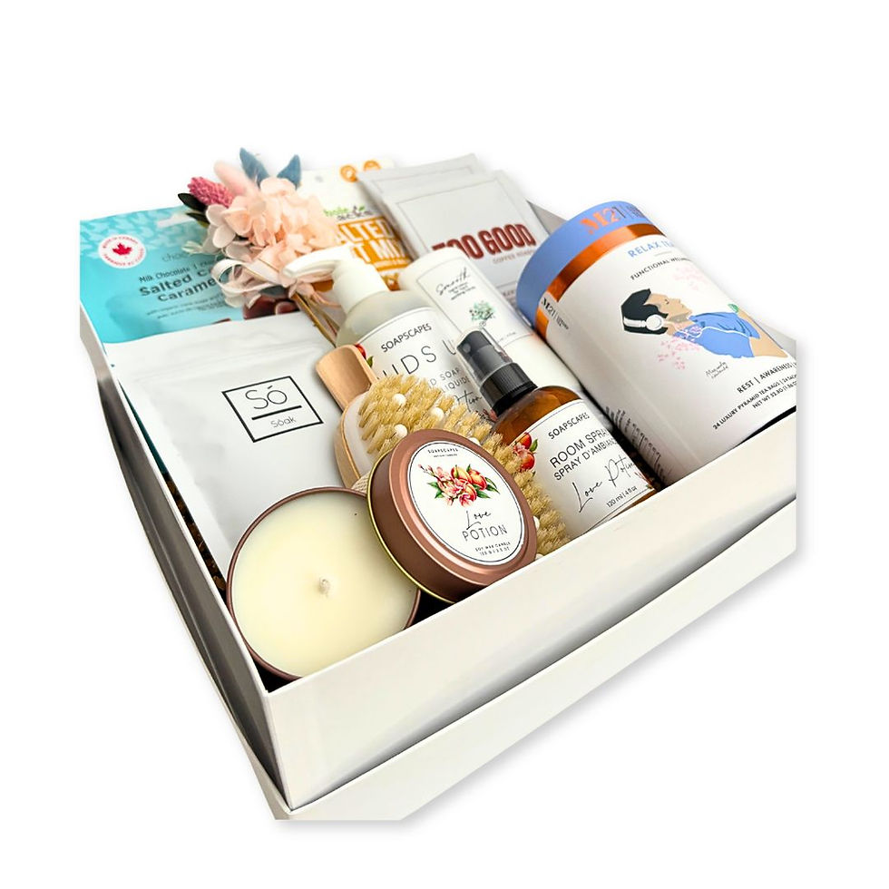 A Little Luxury Gift Box with bath and body products, chocolate, tea, coffee and snacks.