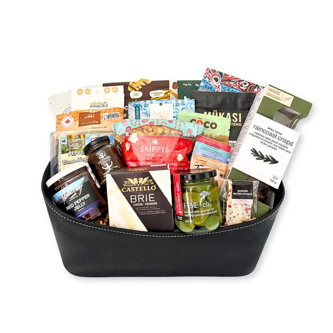 The Christmas Spread Gift Basket with gourmet snacks, Brie, chocolates, coffee and tea.