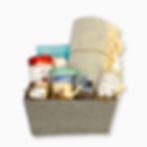 Cloth gift basket with a blanket, mug, hand soap, lotion and room spray, chocolates, tea, candle and nuts. From BC.
