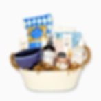 Gift basket with products from British Columbia presented in a white metal container. Contents include food & home items.