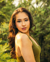 brunette latina women posing for a portrait with trees behind her in Fort Worth