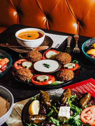 table full of mediterranean dishes