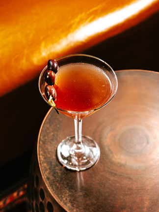 dirty martini on bronze table